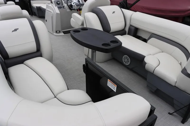 Slide: The Image of Interior of 2024 Starcraft EXS 3 boat with plush seating and cup holders. - 17