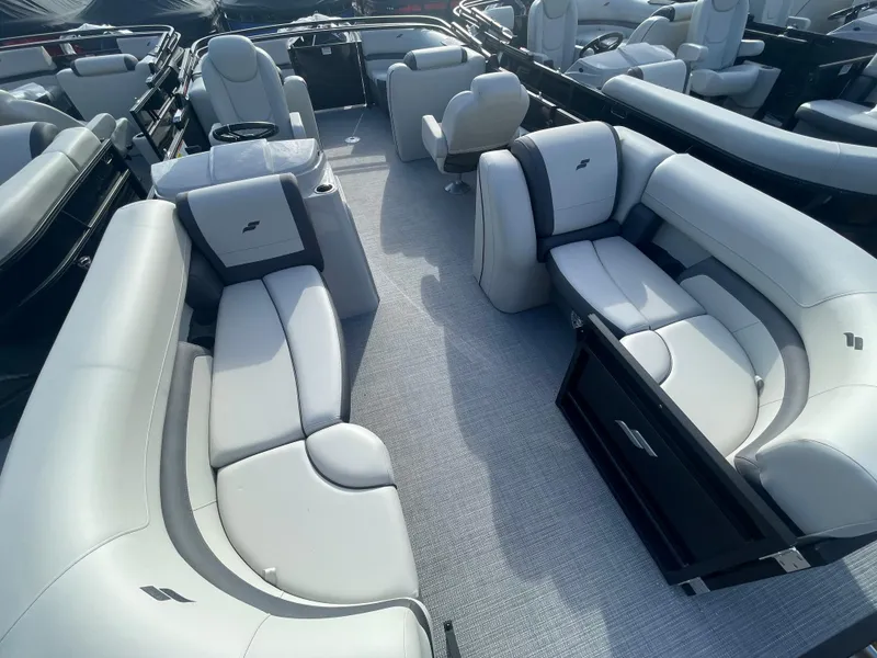 Slide: The Image of 2024 Starcraft EXS 3 pontoon boat interior with luxurious seating and modern design. - 19
