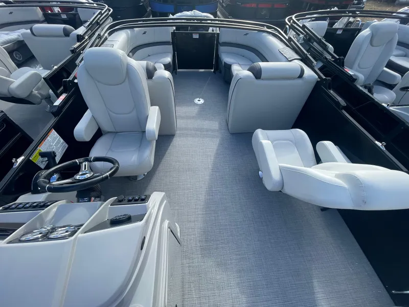 Slide: The Image of 2024 Starcraft EXS 3 boat interior with plush seating and modern helm. - 20