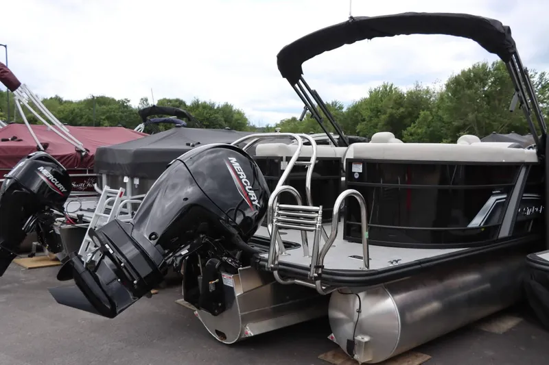 Slide: The Image of 2024 Starcraft EXS 3 pontoon boat with Mercury outboard motor. - 4
