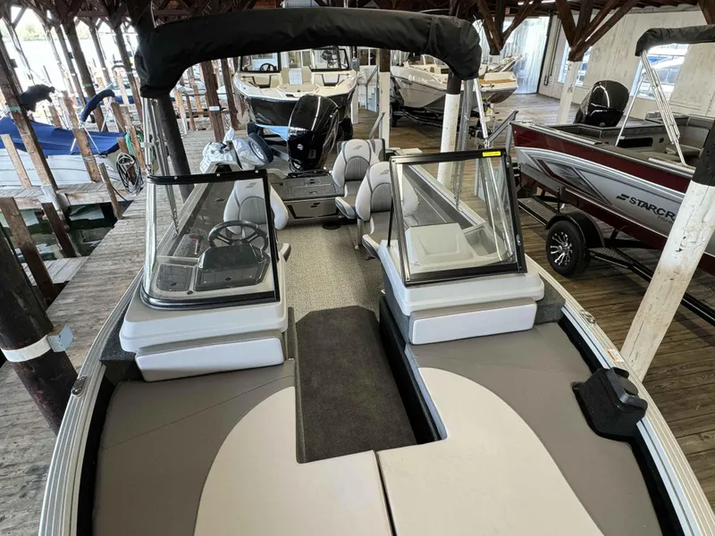 Slide: The Image of 2023 Starcraft Delta 188 FXS boat interior at a marina. - 18