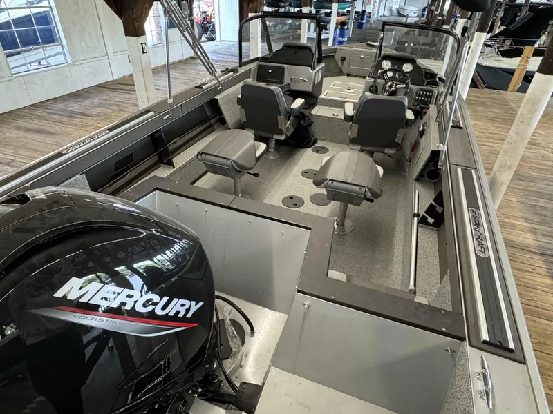 Slide: The Image of 2023 Starcraft Delta 188 FXS boat interior with Mercury FourStroke engine. - 6