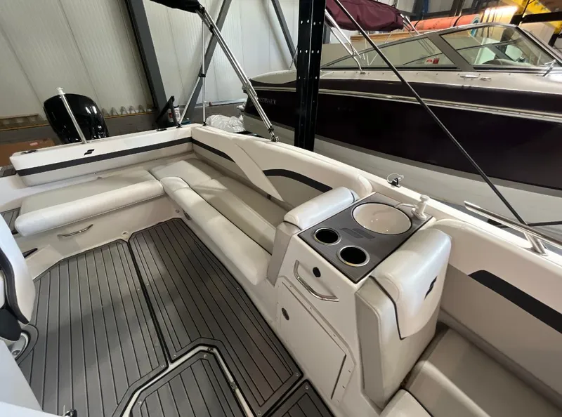 Slide: The Image of Interior of 2023 Starcraft SVX 191 OB boat with seating and cup holders. - 8