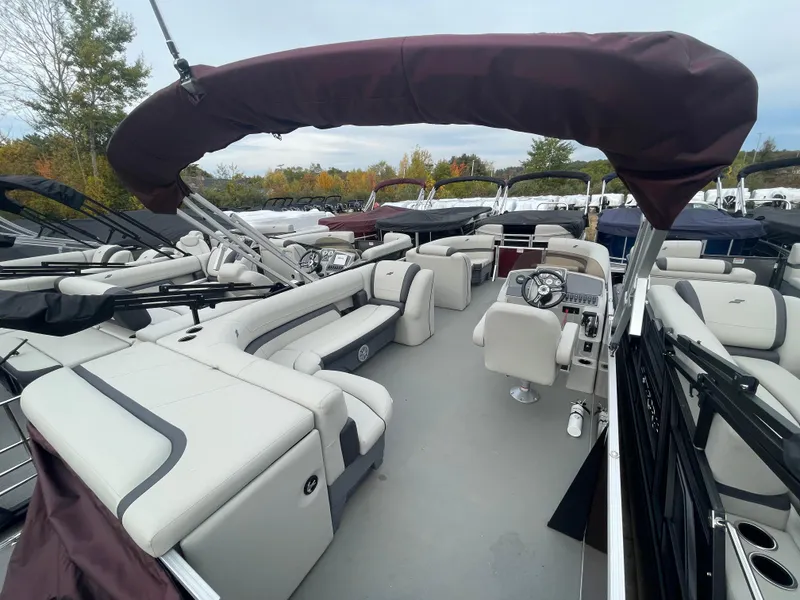 Slide: The Image of 2023 Starcraft EX 22C pontoon boat with spacious seating and modern design. - 11
