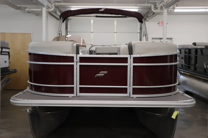 Slide: The Image of 2023 Starcraft EX 22C pontoon boat in showroom, front view. - 5