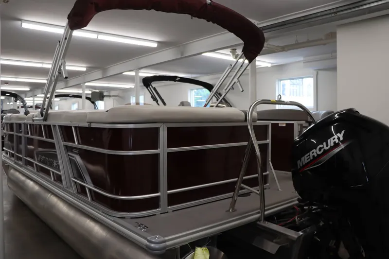 Slide: The Image of 2023 Starcraft EX 22C pontoon boat with Mercury engine in showroom. - 7