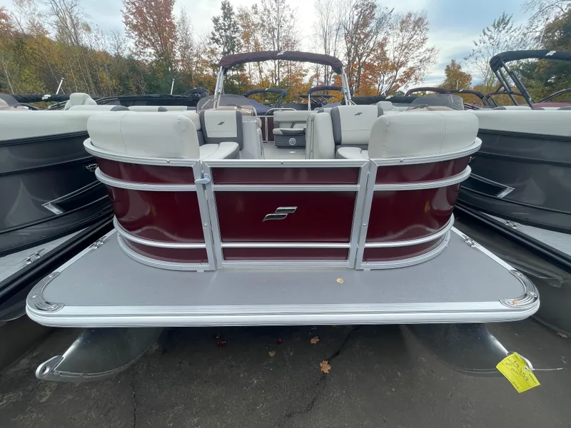 Slide: The Image of 2023 Starcraft EX 22C pontoon boat with red and white seating. - 8