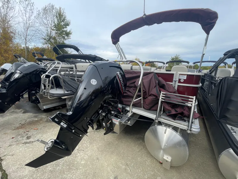 Slide: The Image of 2023 Starcraft EX 22C pontoon boat with Mercury outboard motor. - 9