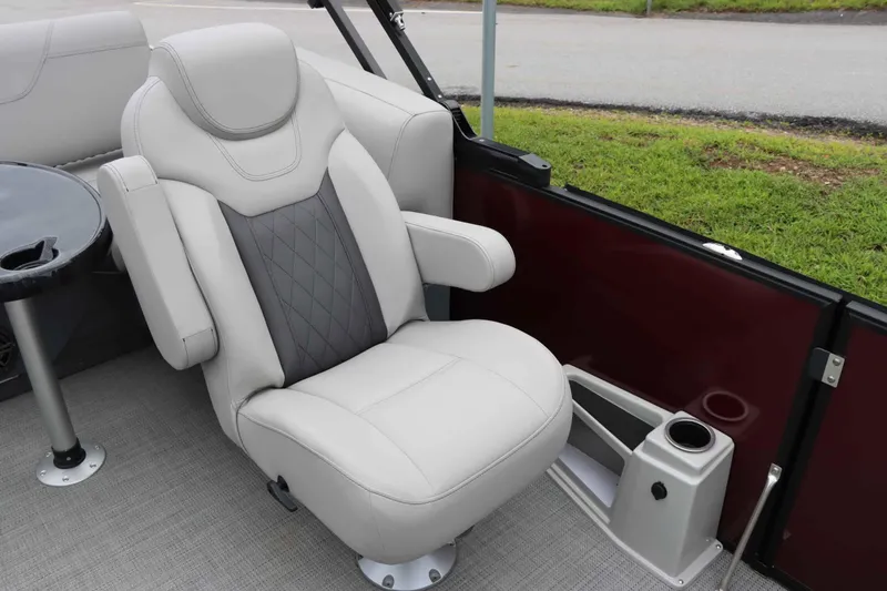 Slide: The Image of Luxurious seating in 2023 Starcraft CX 23Q DH boat with cup holder and table. - 10