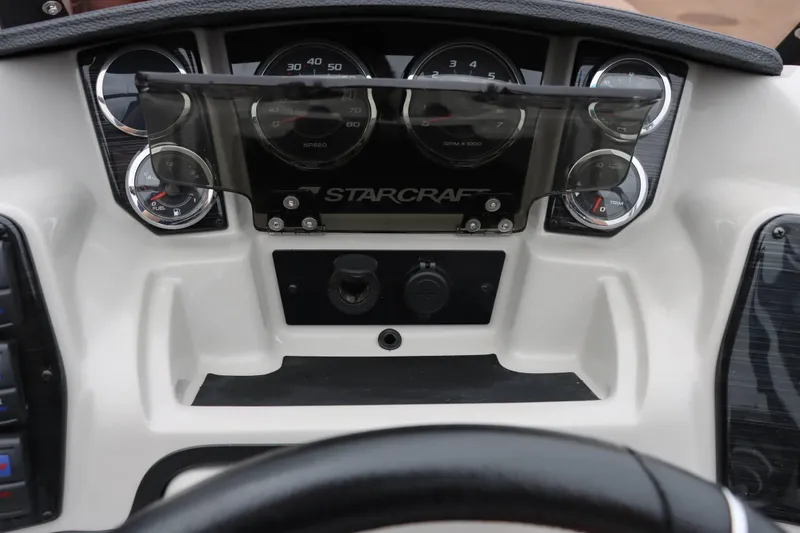 Slide: The Image of Dashboard of 2023 Starcraft CX 23Q DH boat with gauges and controls. - 13