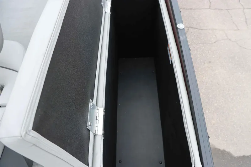 Slide: The Image of Open storage compartment in 2023 Starcraft CX 23Q DH boat. - 17
