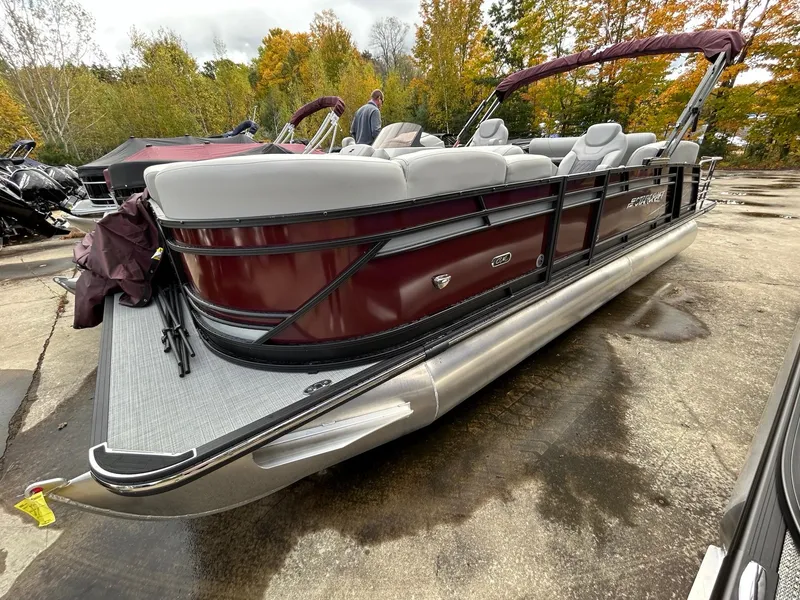 Slide: The Image of 2023 Starcraft CX 23Q DH pontoon boat with maroon exterior and gray seating. - 18