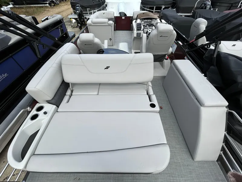 Slide: The Image of 2023 Starcraft CX 23Q DH pontoon boat interior with white seating and helm. - 20