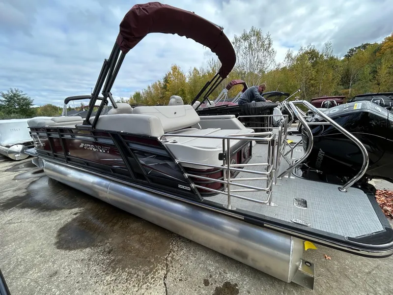 Slide: The Image of 2023 Starcraft CX 23Q DH pontoon boat with maroon and silver accents. - 22
