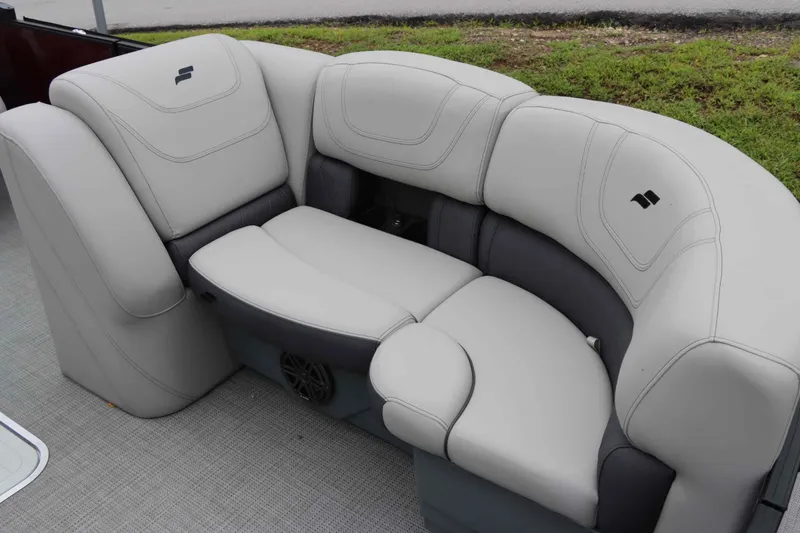 Slide: The Image of Luxurious seating on 2023 Starcraft CX 23Q DH pontoon boat, featuring plush gray upholstery. - 9