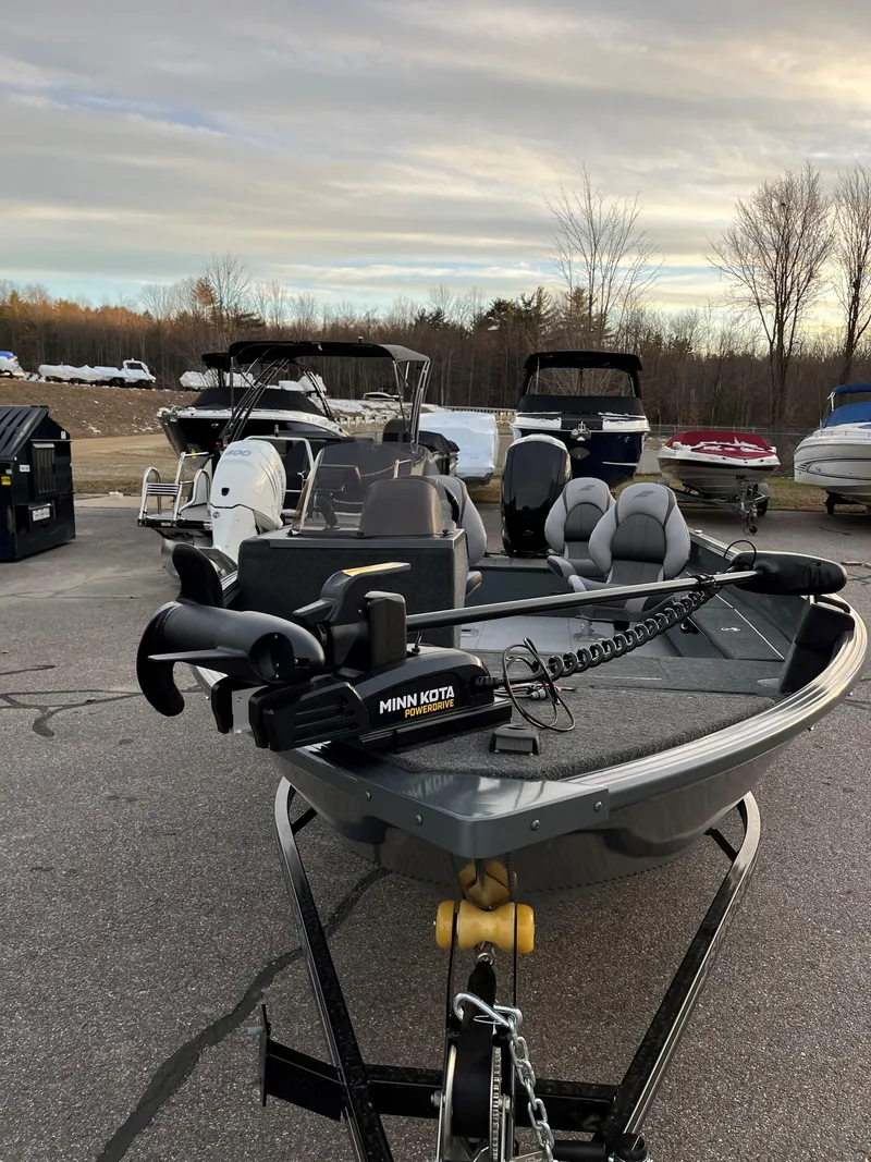 Slide: The Image of 2023 Starcraft Storm 176 SC boat with Minn Kota PowerDrive motor in a parking lot. - 3