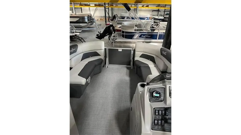 Slide: The Image of 2023 SunChaser Geneva 20CRS pontoon boat interior with spacious seating and modern dashboard. - 4