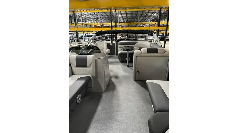 Slide: The Image of 2023 SunChaser Geneva 20CRS pontoon boat interior with seating and helm. - 5