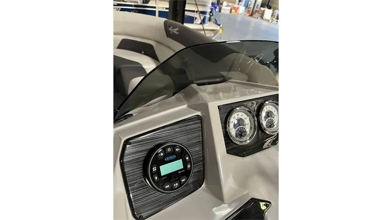Slide: The Image of 2023 SunChaser Geneva 20CRS boat dashboard with gauges and control panel. - 8