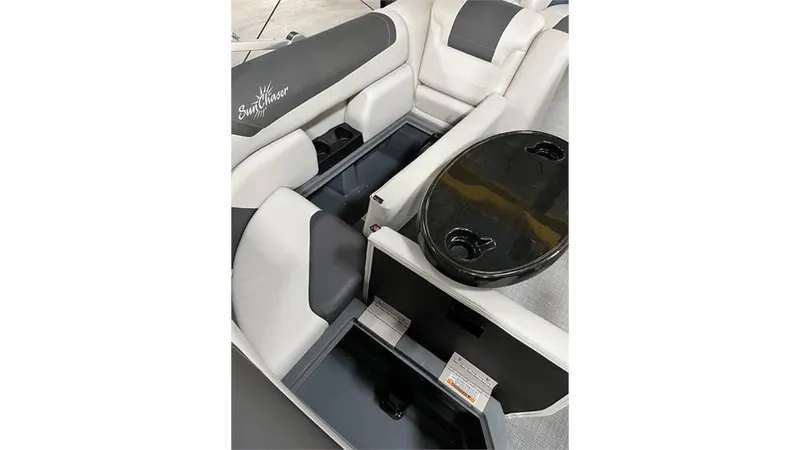 Slide: The Image of 2023 SunChaser Geneva 20CRS boat interior with seating and storage compartments. - 9