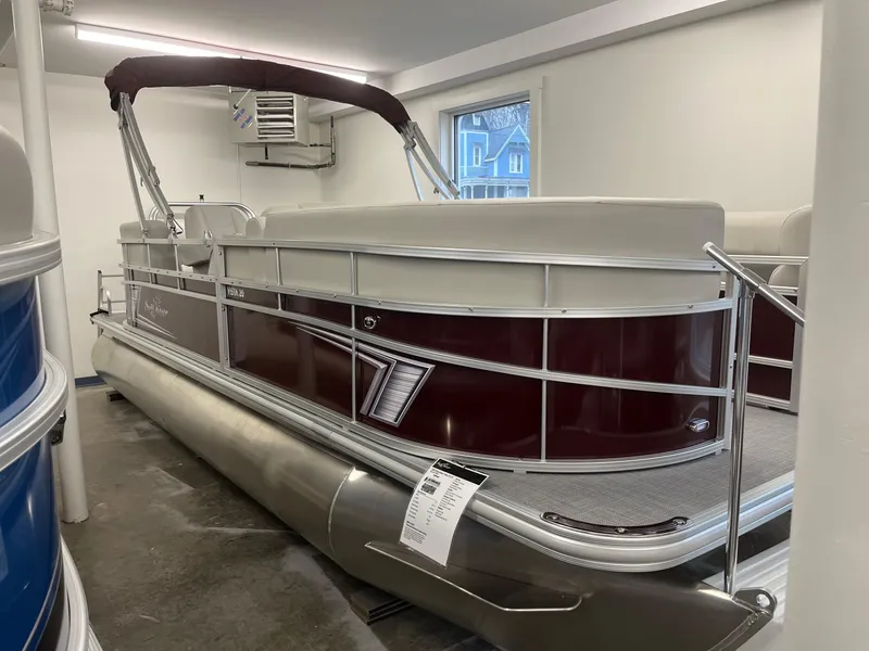 Slide: The Image of 2023 SunChaser VISTA 20LR pontoon boat in showroom. - 1