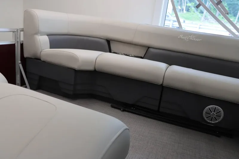 Slide: The Image of 2023 SunChaser VISTA 20LR boat interior with plush seating and integrated speaker. - 10