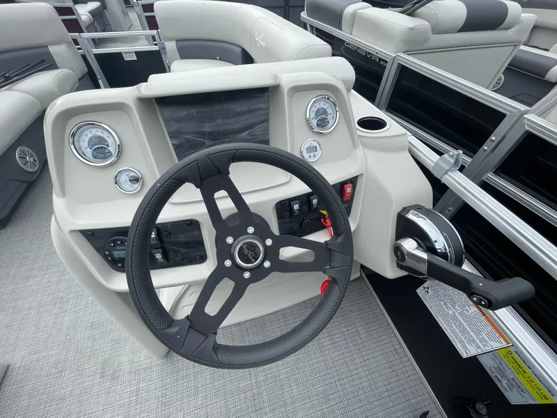 Slide: The Image of 2023 SunChaser VISTA 20LR boat dashboard with steering wheel and control panel. - 5