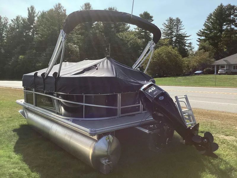 Slide: The Image of 2023 SunChaser VISTA 16LR pontoon boat with black cover and 40 HP motor. - 4