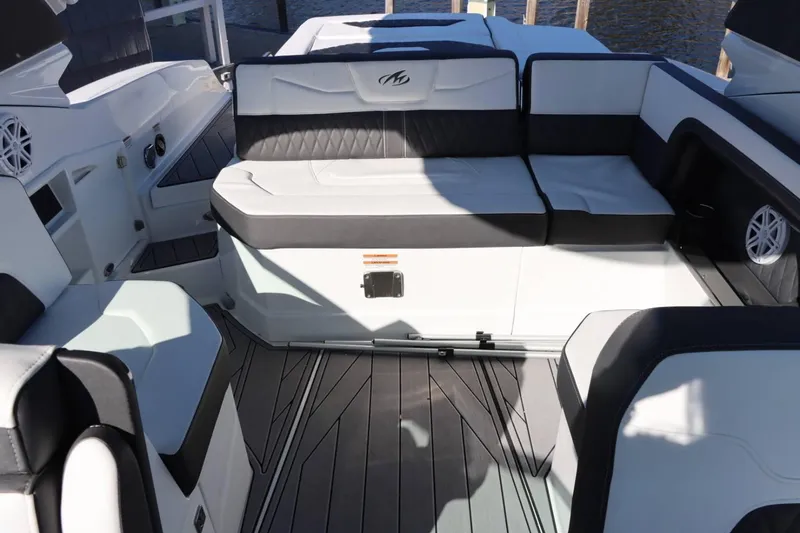 Slide: The Image of Interior seating of 2023 Monterey 298SS boat with black and white upholstery. - 12