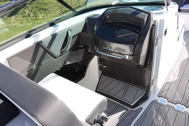 Slide: The Image of Interior of 2023 Monterey 298SS boat with modern seating and storage compartments. - 14