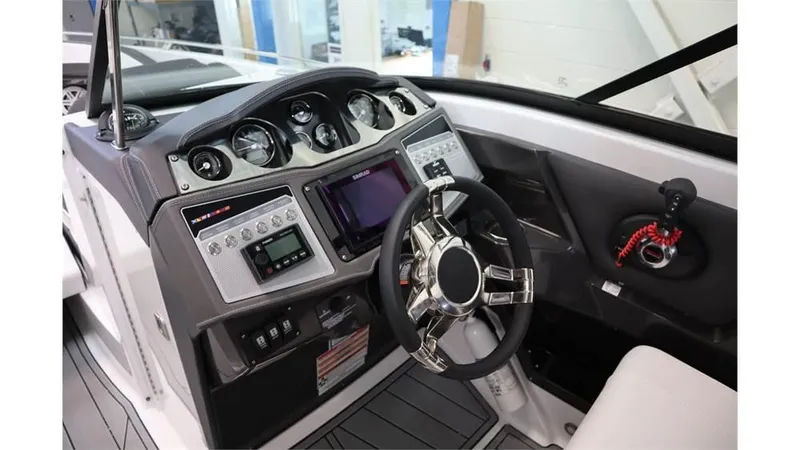 Slide: The Image of 2023 Monterey 298SS boat dashboard with modern controls and steering wheel. - 15