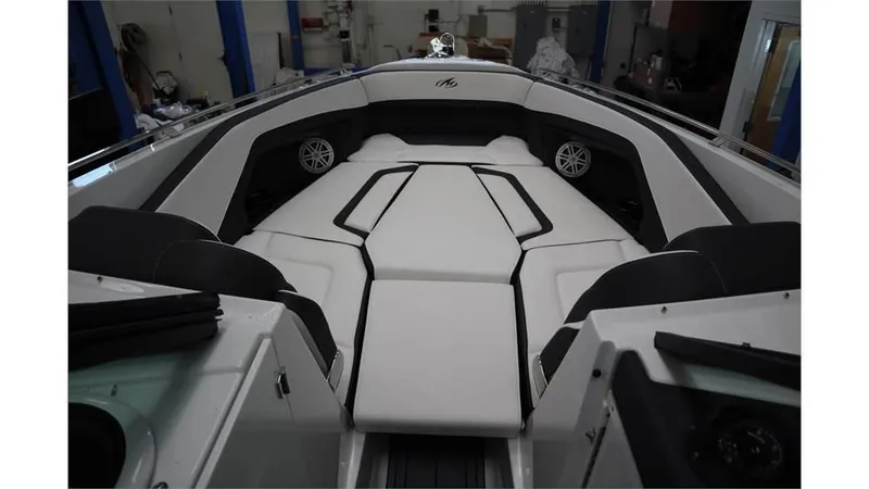 Slide: The Image of 2023 Monterey 298SS boat interior with white cushioned seating and built-in speakers. - 18