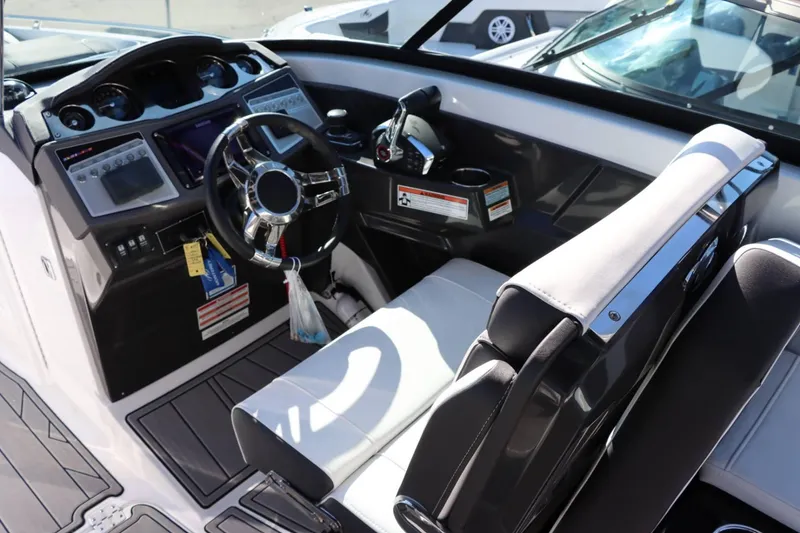 Slide: The Image of 2023 Monterey 298SS boat cockpit with modern steering wheel and control panel. - 19