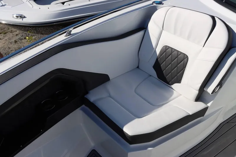 Slide: The Image of Luxurious seating on the 2023 Monterey 298SS boat with white and black upholstery. - 23