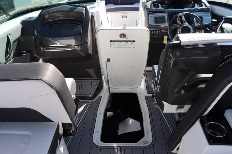 Slide: The Image of Interior of 2023 Monterey 298SS boat showing seating and storage compartment. - 27