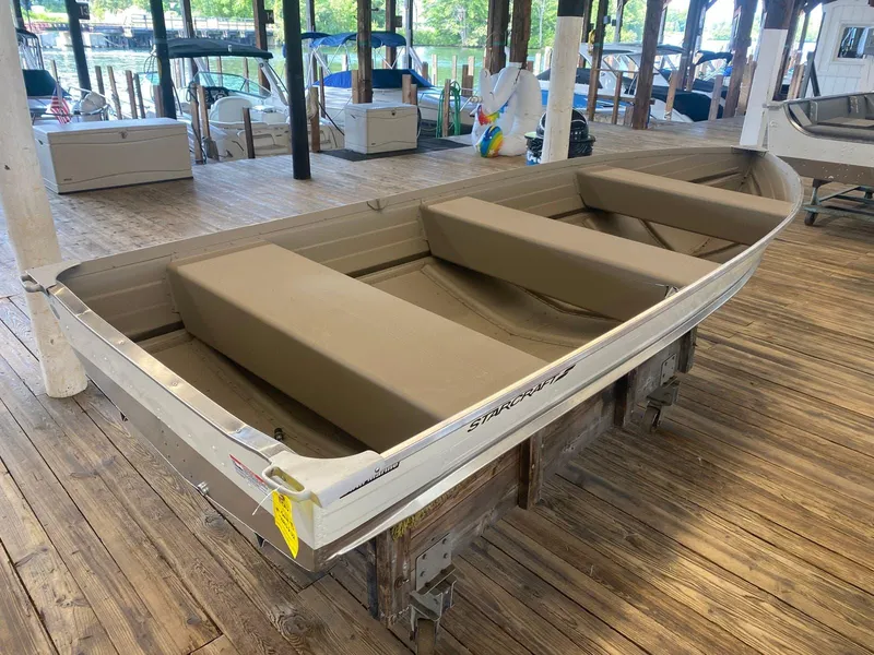 Slide: The Image of 2023 Starcraft 14 SEALITE TS aluminum boat in a marina. - 3