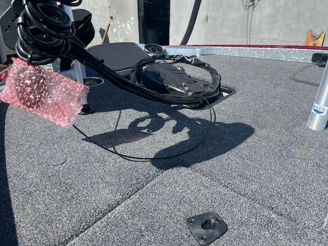 Slide: The Image of 2024 Triton 18 TrX boat deck with equipment and wiring. - 3