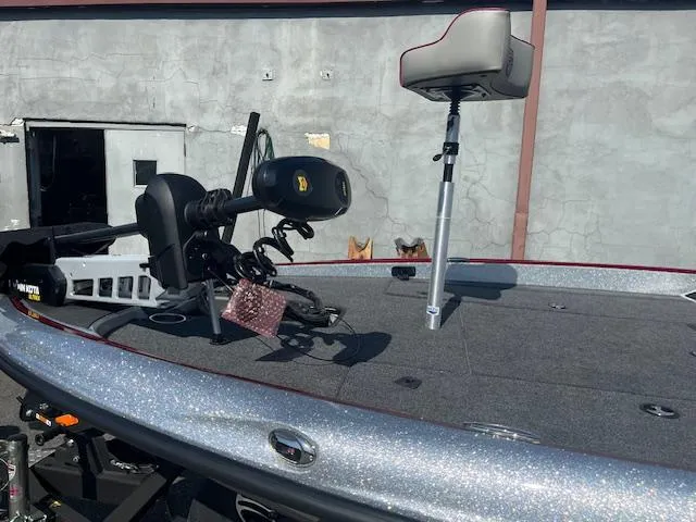 Slide: The Image of 2024 Triton 18 TrX boat deck with trolling motor and seat. - 6