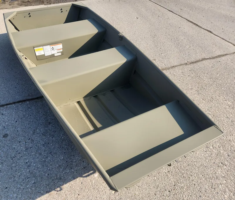 Slide: The Image of 2024 Tracker Grizzly 1036 Jon boat on concrete surface. - 3