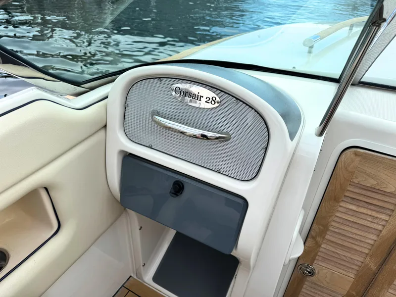 Slide: The Image of 2004 Chris-Craft Corsair 28 boat interior detail with storage compartment. - 22