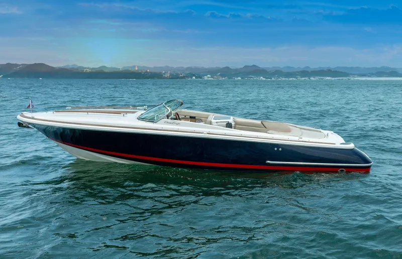 Slide: The Image of 2004 Chris-Craft Corsair 28 boat on open water with scenic background. - 3