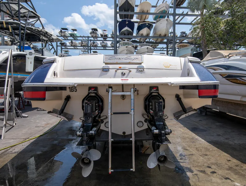 Slide: The Image of 2004 Chris-Craft Corsair 28 boat in storage, rear view showing dual engines. - 33