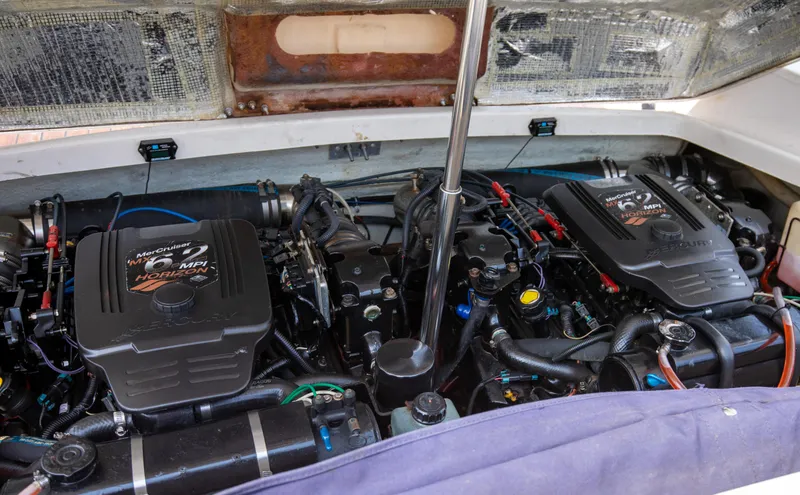 Slide: The Image of 2004 Chris-Craft Corsair 28 engine compartment with twin MerCruiser engines. - 37