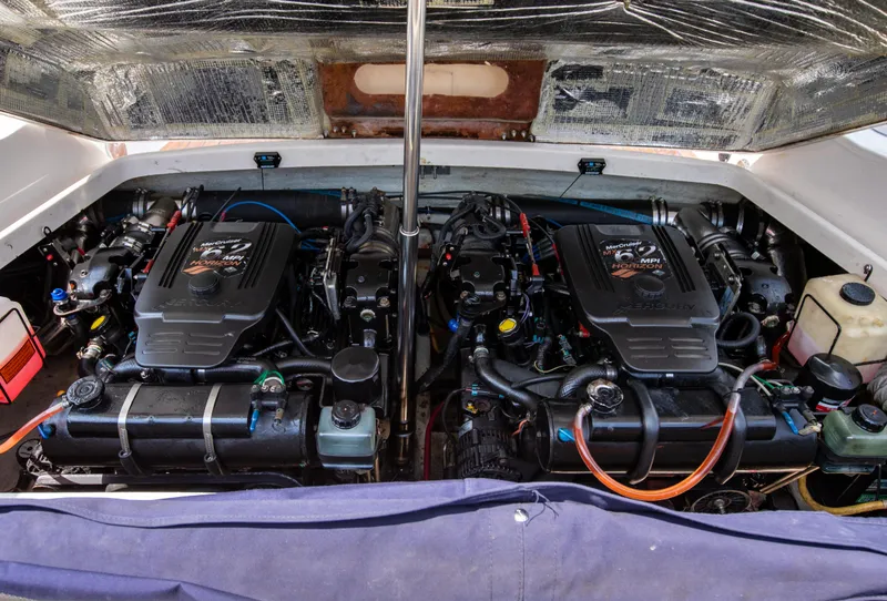 Slide: The Image of 2004 Chris-Craft Corsair 28 engine compartment with twin engines. - 39