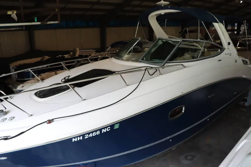 Slide: The Image of 2012 Sea Ray 280 Sundancer boat in storage, side view. - 1