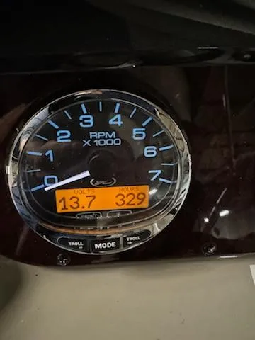 Slide: The Image of Sea Ray 280 Sundancer 2012 RPM gauge showing 13.7 volts and 329 hours. - 10