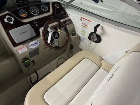 Slide: The Image of Cockpit of 2012 Sea Ray 280 Sundancer with steering wheel and navigation instruments. - 12