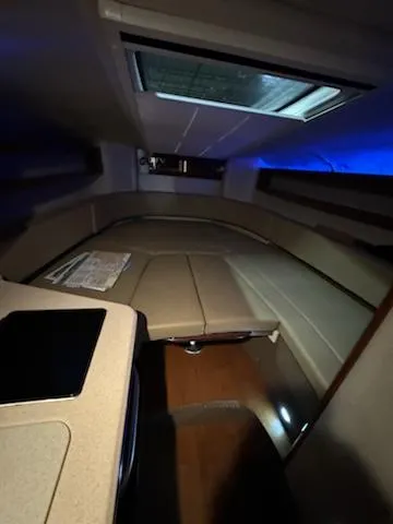 Slide: The Image of Interior cabin of 2012 Sea Ray 280 Sundancer with seating and skylight. - 13