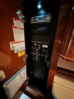 Slide: The Image of Electrical control panel inside 2012 Sea Ray 280 Sundancer boat. - 14