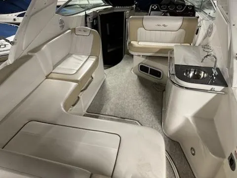 Slide: The Image of Interior of a 2012 Sea Ray 280 Sundancer boat with seating and sink. - 15